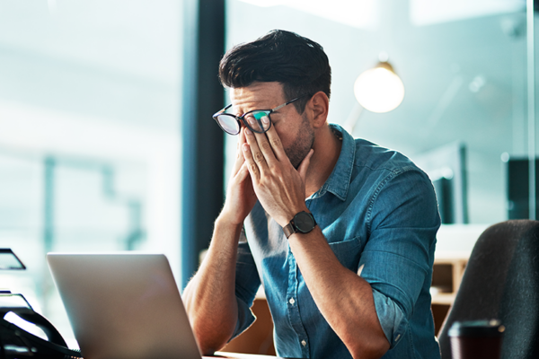 Employee experiencing workplace stress during a risk assessment
